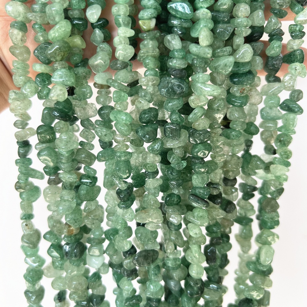 Authentic irregular green Strawberry Quartz chip beads, ideal for creating crystal healing jewelry with unique energy.