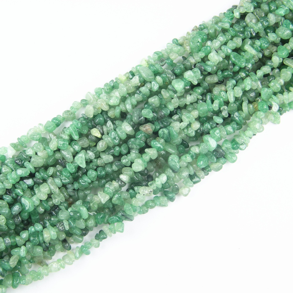 Beautifully irregular Green Strawberry Quartz chip beads, perfect for crafting jewelry with healing properties and vibrant energy