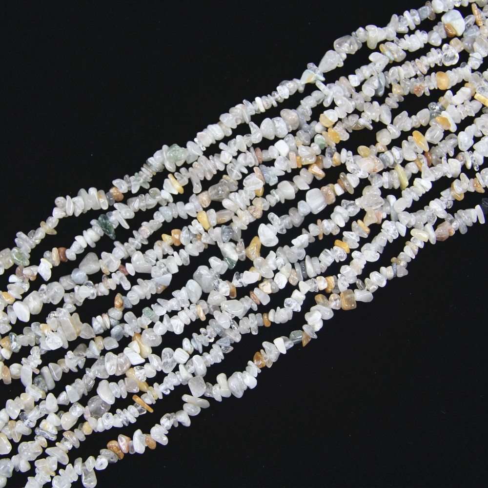 Add sparkle and texture to your handmade jewelry with these Rutilated Quartz Beads. With their 5-8mm chip size and golden or silver rutile inclusions, these natural beads are perfect for designing beautiful, eye-catching pieces like rings, necklaces, and bracelets.