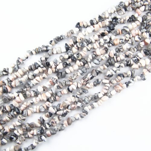 These Zebra Jasper Chip Beads offer a striking contrast of black and white, perfect for designing bold jewelry pieces. Whether you're creating a statement necklace or a stylish bracelet, these 5-8mm natural gemstone chips will add a touch of elegance and uniqueness.