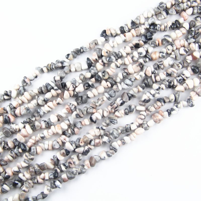 These Zebra Jasper Chip Beads offer a striking contrast of black and white, perfect for designing bold jewelry pieces. Whether you're creating a statement necklace or a stylish bracelet, these 5-8mm natural gemstone chips will add a touch of elegance and uniqueness.