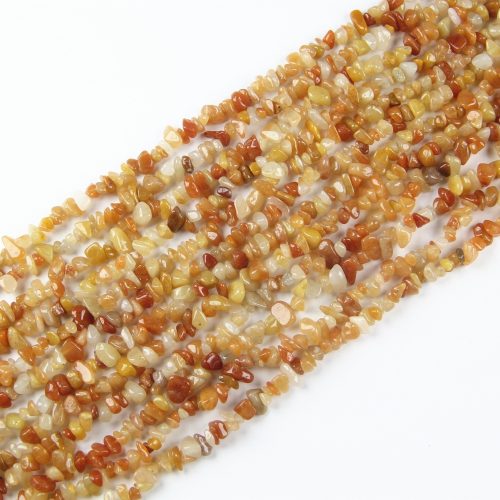 Add a fiery touch to your jewelry designs with these stunning Red Aventurine Chip Beads. Each 5-8mm gemstone chip radiates a rich red hue, perfect for creating vibrant and bold bracelets, necklaces, and earrings.