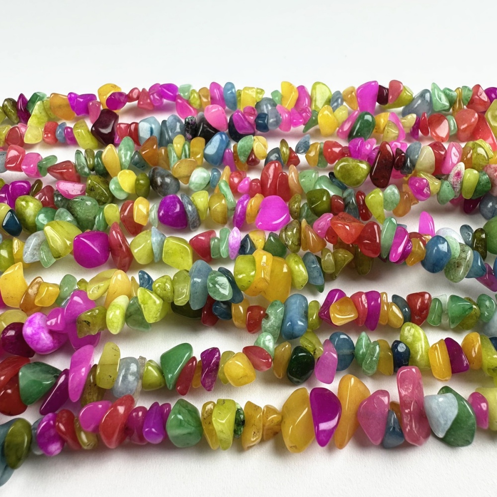Natural Nugget Gemstone Beads in rainbow tones. Irregular Crystal Chip Beads on strand – versatile for wholesale jewelry projects.