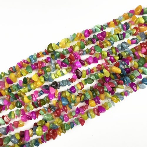 Close-up Rainbow Gemstone Chip Beads nuggets. Natural irregular shapes & polished finish – perfect Nugget Gemstone Beads for healing designs.