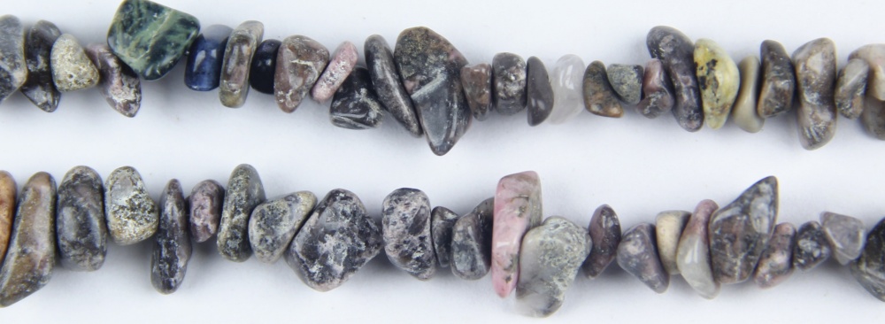 Create beautiful jewelry with 32” of Black Vein Rhodochrosite nugget beads, a natural stone with rich color and texture