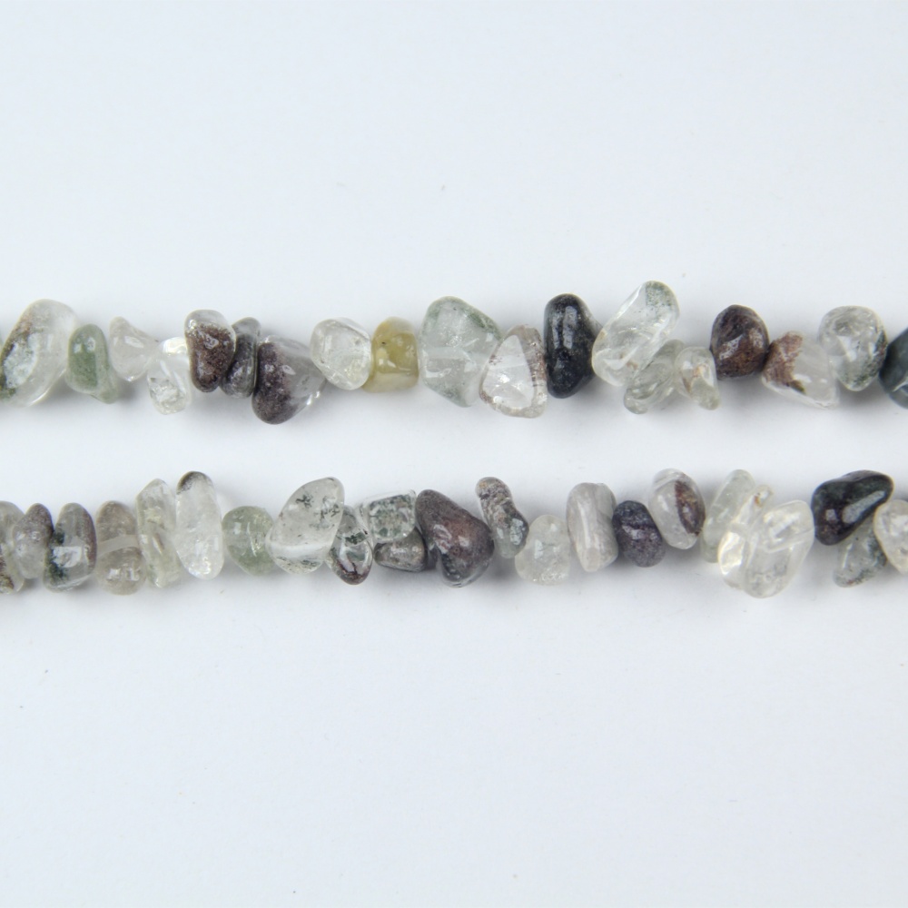 These Green Phantom Chip Beads (5-8mm) are real crystal beads, perfect for creating necklaces, bracelets, and earrings with natural green hues