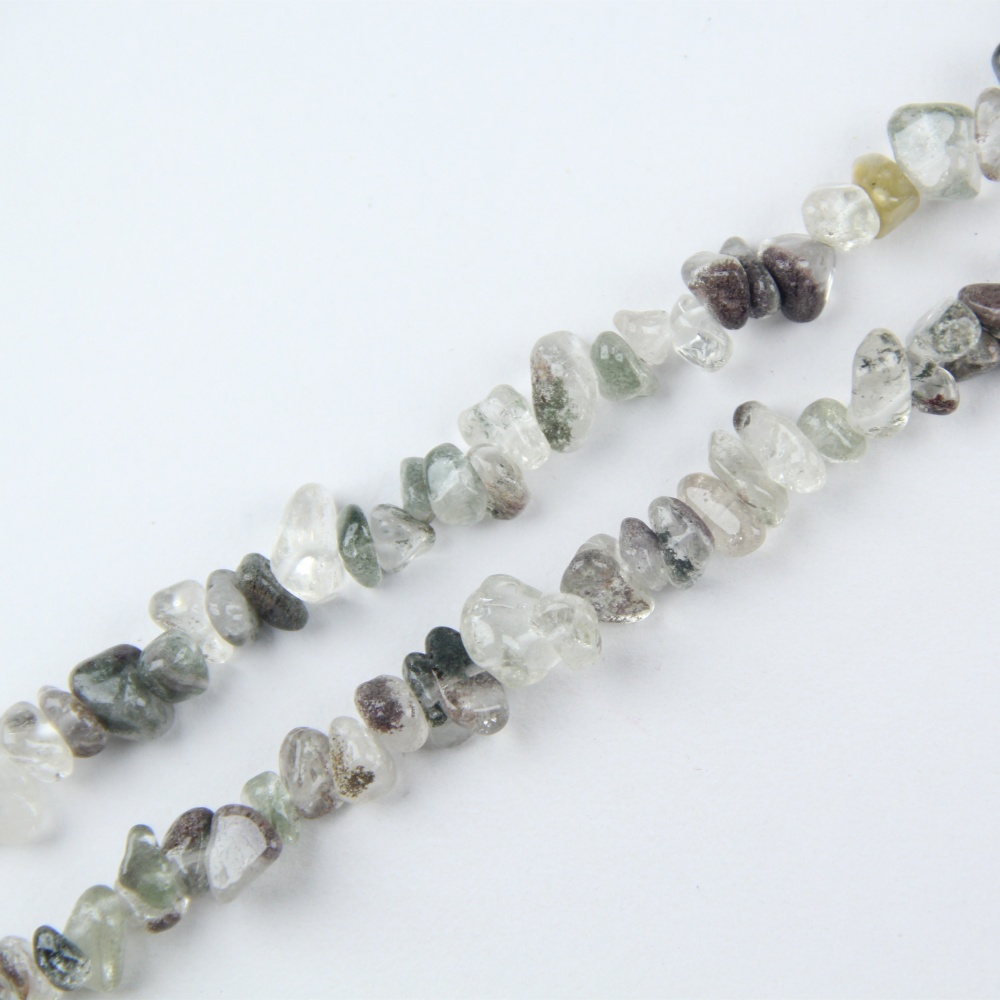 These authentic Green Phantom Chip Beads are crystal chip beads with drilled holes, ideal for creating DIY jewelry and unique designs