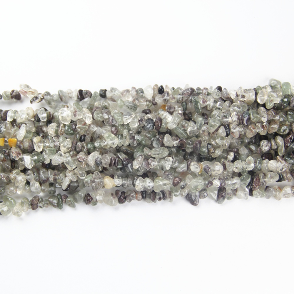 Loose, drilled Green Phantom crystal chip beads (5-8mm) in natural green hues are perfect for necklaces, bracelets, or spiritual malas