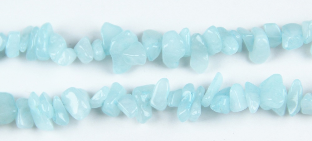 Mixed design featuring aquamarine chip beads alongside complementary stones. Polished drilled crystal chips and aquamarine nuggets as versatile Aquamarine Beads for custom multi-gem jewelry projects
