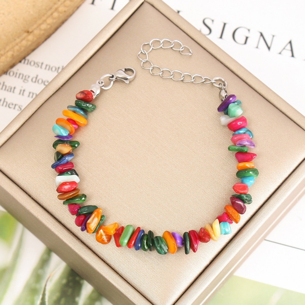Close-up of colorful rainbow shell chip bracelets, natural dyed for healing energy like crystal chip bracelets